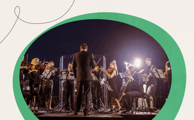 A picture of an orchestra with a conductor