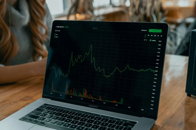 Laptop with a green chart symbolizing conversion rates